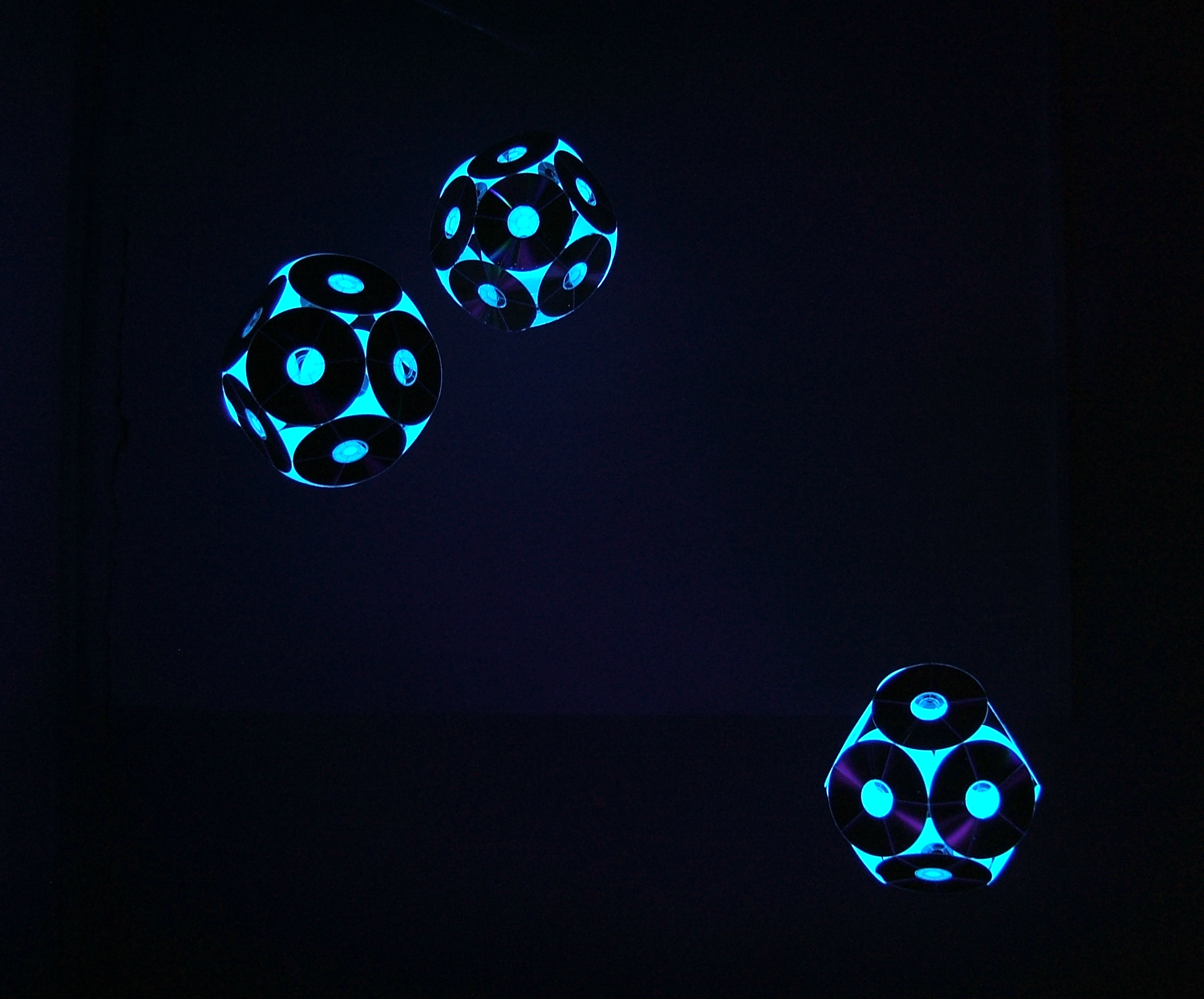Joanna Thede's art work Demodulator featuring 3 spheres of seemingly glowing cold blue colour.